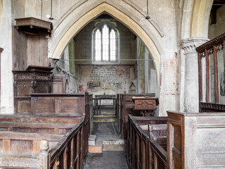 Interior shot of St. John The Baptist church at Inglesham, Wiltshire, an ancient unmodernised small church near the River Thames at Lechlade.