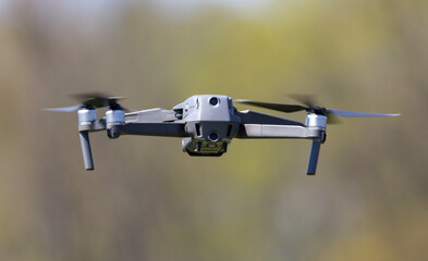 Drone in flight in the park.
