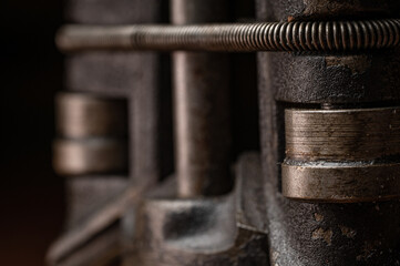 Close up of gears, rollers and metal springs