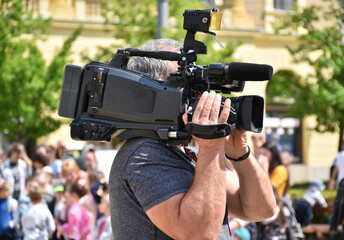 Cameraman at work outdoor on the street