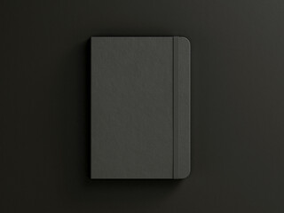 Black moleskine isolated on the black background