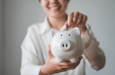 Fototapeta na wymiar Hand holding coin with pig piggy bank. Saving and financial accounts concept
