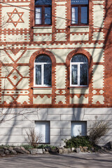 Fototapeta na wymiar modern plastic windows in the wall of the house