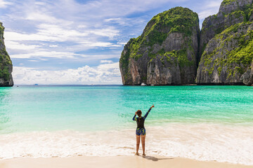 Young Asian lady tourist on the  the beach, Ma Ya bay, Phi Phi island  krabi province Thailand.