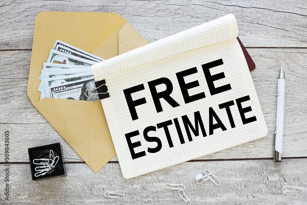 Poster free estimates text on an open paper notebook on the background of a pen, gray table background