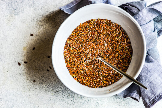 Overhead view of a bowl of organic flax seeds