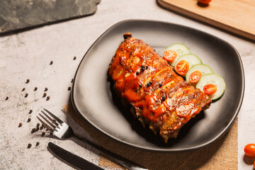 Grilled pork ribs BBQ on black plate,Top view,World food day