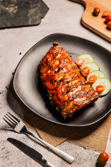 Grilled pork ribs BBQ on black plate,Top view,World food day