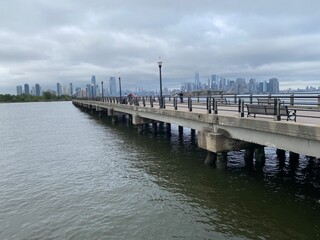 Fototapeta na wymiar New York City skyline by walkway path NYC