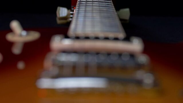 Focus Pull from Tuners to Bridge on Electric Guitar