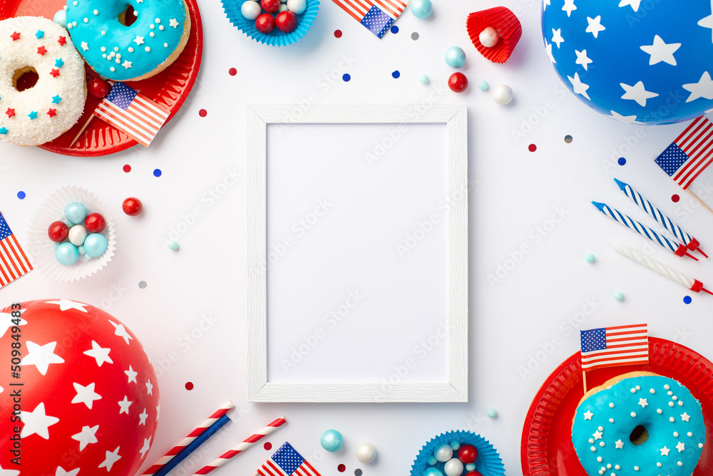 Wall mural fourth of july concept. top view photo of photo frame us national flags balloons confetti candles pa