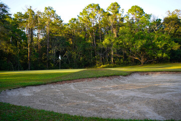 View of Golf Course with beautiful putting green. Golf course with a rich green turf beautiful scenery.