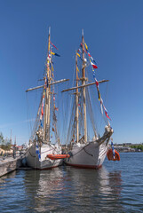 Fototapeta na wymiar The schooner and training boats Gladan and Falken a pier, celebrating 70 year, a sunny summer day in Stockholm