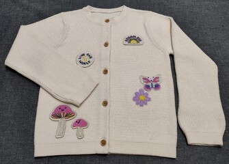 shirt and Sweater. Toddler Girls embroidery and handmade cardigan design cardigan on the dark grey background. Best quality.