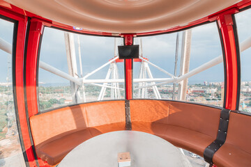 Interior of a cabin of ferris wheel in amusement luna park. Entertainment and fair concept. Inside...