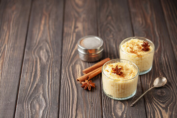 Obraz na płótnie Canvas Curau de Milho (Brazilian Corn Pudding). Traditional Brazilian dessert. Corn porridge with cinnamon in a bowl.