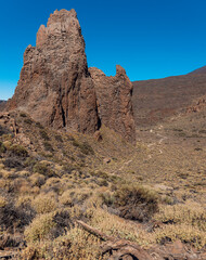 Fototapeta premium The Citadel rock formation and a walking path in Teide National Park. Roques de García trail. Volcano and volcanic landscape. Tenerife, Canary islands, Spain.