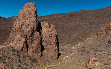 The Citadel rock formation and a walking path in Teide National Park. Roques de García trail....