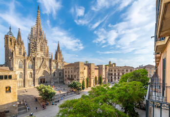 View from a balcony of the Gothic Barcelona Cathedral of the Holy Cross and Saint Eulalia and the plaza in the El Born district of Barcelona. - obrazy, fototapety, plakaty
