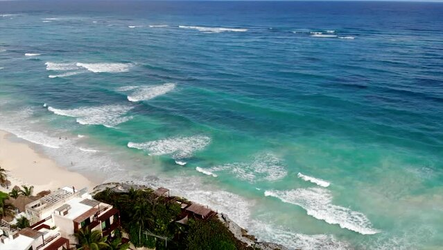 aerial view of Tulum beach whit blue Caribbean Sea and white sand beach on a sunny afternoon