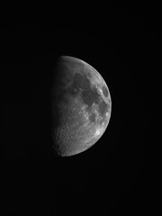 Waxing Gibbous moon in dark black space