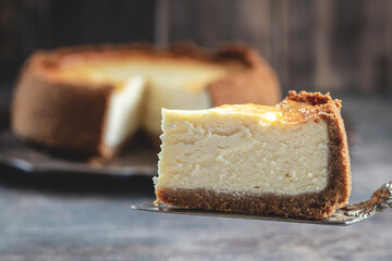 New York cheesecake is a dessert that is an open pie or even a cake. Decorated with strawberries. It consists of two main parts: sand base and cheese filling.