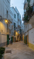 Monopoli - The old town aisle with the  at dusk.
