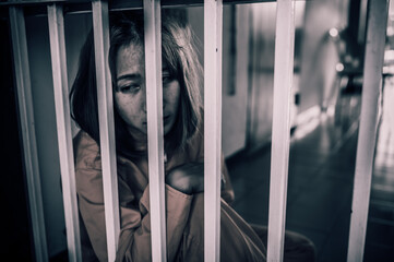 Portrait of women desperate to catch the iron prison,prisoner concept,thailand people,Hope to be...
