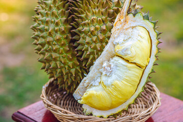 Durian riped and fresh ,durian peel with yellow colour on wooden table.