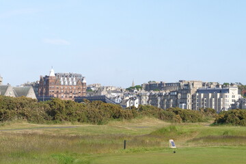 Cityscape of St Andrews, Scotland on a sunny day as seen from the legendary old course on St...