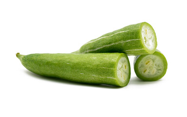 Snake gourd slices over white background