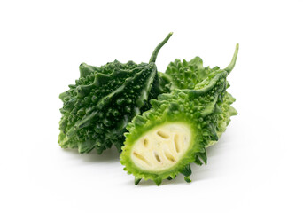 bitter melon or bitter gourd pieces isolated on white background, selective focus