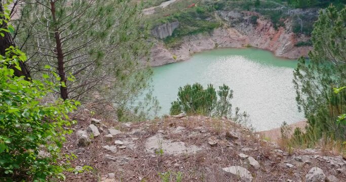 Small artificial lake created in a former quarry in Modugno, near Bari. Nature has created a wild but pleasant environment.
