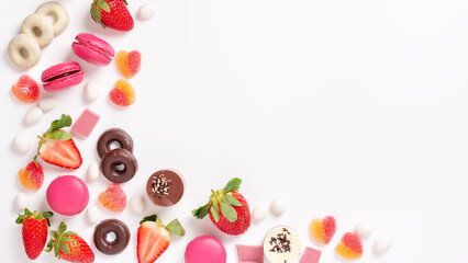 Valentines day background border with pink and chocolate sweets, copy space