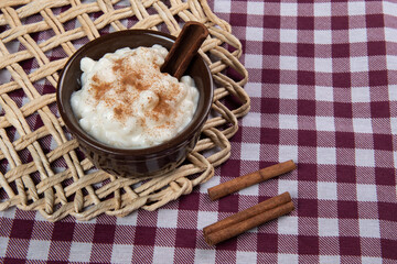 traditional sweet from the Brazilian June festivals, made of white corn with coconut and condensed milk and sprinkled with cinnamon