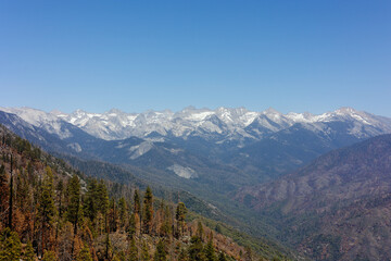 Fototapeta na wymiar Mountain range negative space with blue skies and sharp peaks