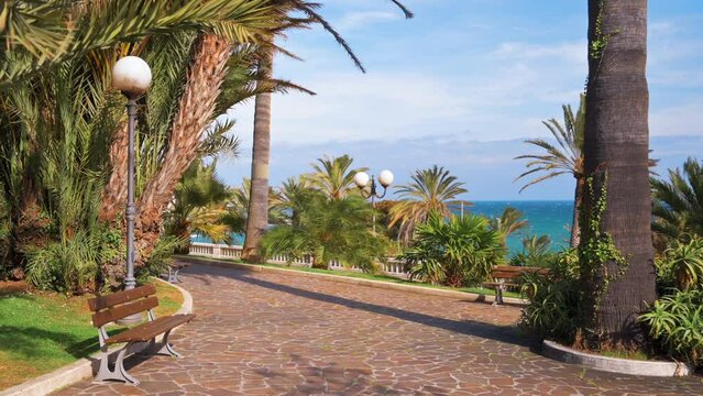 Mediterranean sea coast in Sanremo, Italy. Embankment street with a lot of greenery