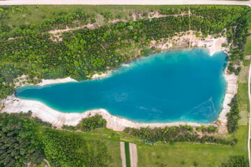 ariel top view of an old flooded lime quarry with turquoise water - obrazy, fototapety, plakaty