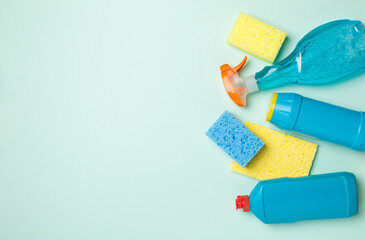 Many different house cleaning products on color background, top view