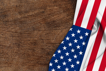 American flag wave on wood background