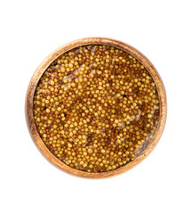 Top view of Dijon or French mustard in wooden bowl on white background.