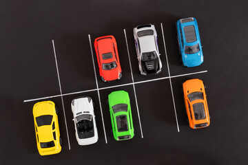 Toy cars in the parking lot. Kids game concept.