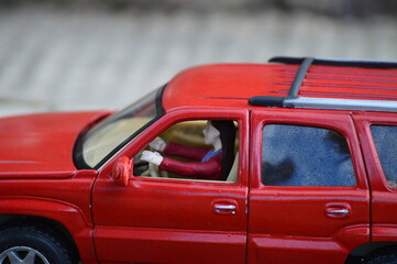 miniature of girl driving a car