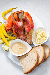 roasted pork knee with picked vegetables, bread and mustard