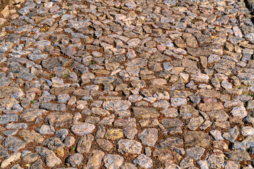 Vintage cobbled stone path or road