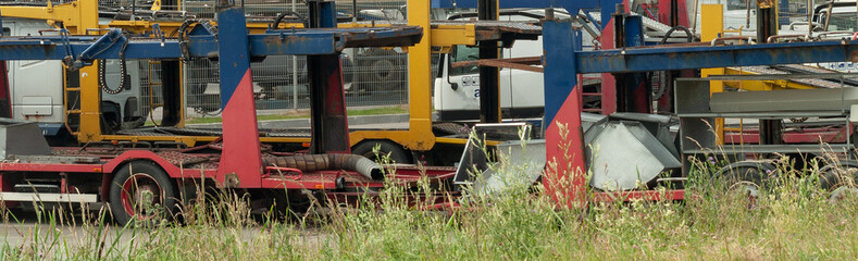 old rusty transport trucks on a junkyard, site blog page header