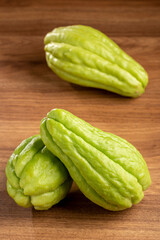 Fresh chayote fruits on the table.