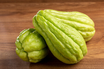 Fresh chayote fruits on the table.