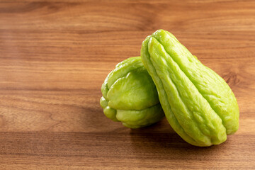 Fresh chayote fruits on the table.