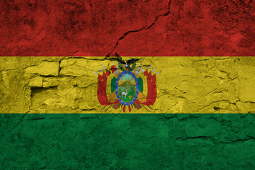 Patriotic cracked wall background in colors of national flag. Bolivia